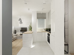 Projekt mieszkania na Bielanach o pow. 51,5 m2. - Mała otwarta z salonem biała z zabudowaną lodówką kuchnia w kształcie litery u z wyspą lub półwyspem, styl nowoczesny - zdjęcie od 4ma projekt