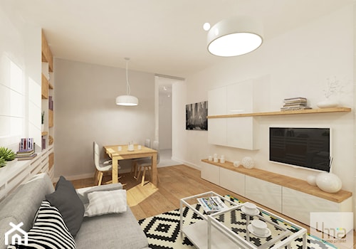 Projekt mieszkania w Wilanowie, pow. 52 m2 - Średni biały szary salon z jadalnią z bibiloteczką, styl skandynawski - zdjęcie od 4ma projekt