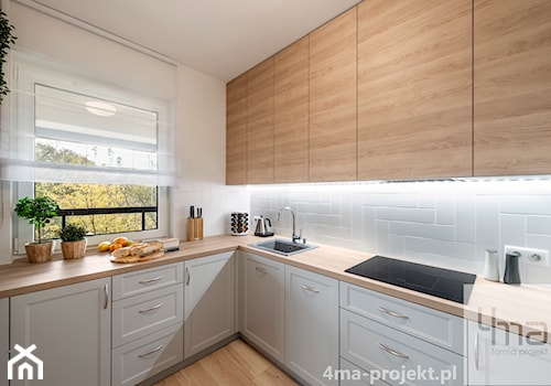 Mieszkanie 83 m2 - Wola - Średnia zamknięta biała z zabudowaną lodówką z nablatowym zlewozmywakiem kuchnia w kształcie litery l z oknem, styl nowoczesny - zdjęcie od 4ma projekt