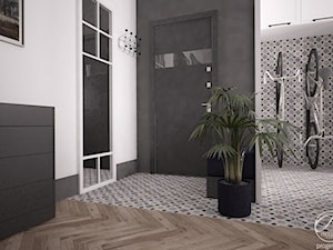Mieszkanie w klimatycznej kamienicy - Średni z wieszakiem biały czarny hol / przedpokój, styl nowoczesny - zdjęcie od Progetti Architektura