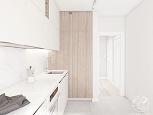 Apartament w jasnych barwach - Średnia zamknięta z kamiennym blatem szara z zabudowaną lodówką z podblatowym zlewozmywakiem kuchnia jednorzędowa z marmurem nad blatem kuchennym, styl nowoczesny - zdjęcie od Progetti Architektura