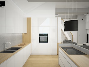 Aranżacja wnętrza mieszkalnego - Średnia otwarta z zabudowaną lodówką z podblatowym zlewozmywakiem kuchnia w kształcie litery g, styl nowoczesny - zdjęcie od ROARHIDE Industrial Designs