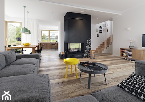 Duży biały czarny salon z jadalnią, styl skandynawski - zdjęcie od DOMY Z WIZJĄ - nowoczesne projekty domów