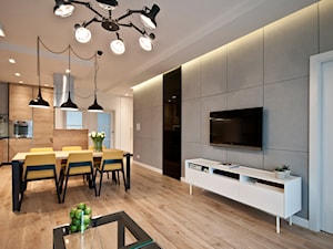 Projekt mieszkania w bloku. - Średni szary salon z kuchnią z jadalnią, styl nowoczesny - zdjęcie od MKdezere