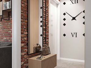 soft loft-jasnoszary przedpokój, ściana z cegły - zdjęcie od MIKOŁAJSKAstudio