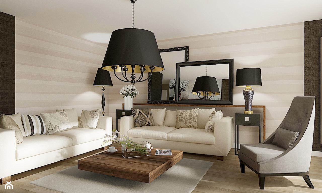 lampa wisząca z czarnym abażurem, białe sofy, szary fotel na nóżkach, drewniana podłoga, szary dywan