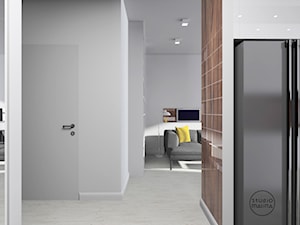 Błyszczące mieszkanie - Średni biały hol / przedpokój - zdjęcie od Studio Malina – Architekci & Projektanci wnętrz