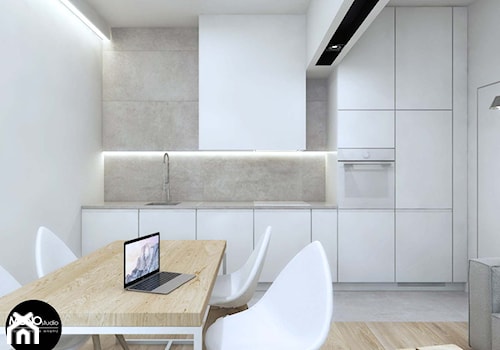 biel&minimalizm - Mała otwarta z salonem z kamiennym blatem biała szara z zabudowaną lodówką z podblatowym zlewozmywakiem kuchnia jednorzędowa, styl minimalistyczny - zdjęcie od MONOstudio