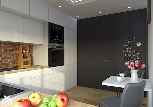 Efekt WOW - Średnia zamknięta czarna pomarańczowa z zabudowaną lodówką kuchnia w kształcie litery l z oknem, styl nowoczesny - zdjęcie od Idea by Mag.