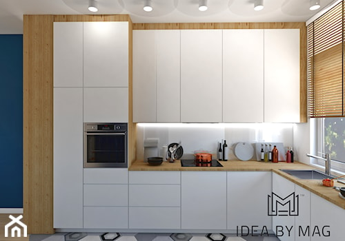 Segment. - Średnia z salonem biała z zabudowaną lodówką z podblatowym zlewozmywakiem kuchnia w kształcie litery l, styl skandynawski - zdjęcie od Idea by Mag.