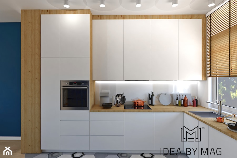 Segment. - Średnia z salonem biała z zabudowaną lodówką z podblatowym zlewozmywakiem kuchnia w kształcie litery l, styl skandynawski - zdjęcie od Idea by Mag.