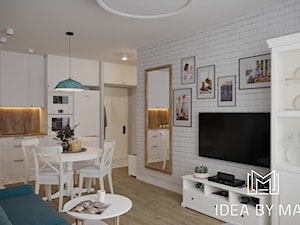 Skandynawskie wnętrze ze szczyptą koloru - Mały biały salon z kuchnią z jadalnią, styl skandynawski - zdjęcie od Idea by Mag.