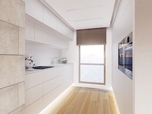 Dom w mieście. - Średnia zamknięta biała z zabudowaną lodówką kuchnia dwurzędowa z oknem, styl minimalistyczny - zdjęcie od DEKA DESIGN