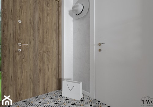 Dom w Jarocinie - Mały z wieszakiem biały szary hol / przedpokój, styl nowoczesny - zdjęcie od Klaudia Tworo Projektowanie Wnętrz