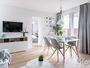 Miętowe dodatki - Średni biały salon z jadalnią, styl nowoczesny - zdjęcie od Pracownia Architektoniczna Małgorzaty Górskiej-Niwińskiej
