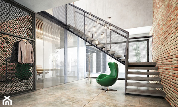 zielony fotel i metalowe schody