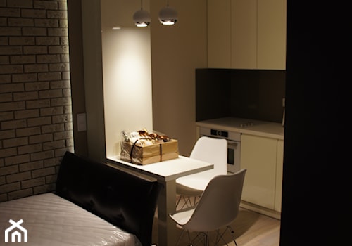 Realizacja wykończenia kawalerki od projektu po wykonanie do wprowadzenia się - Mała czarna szara jadalnia w salonie w kuchni, styl nowoczesny - zdjęcie od Aranżacja | Wnętrza | Projekty | Wykończenia domów i mieszkań