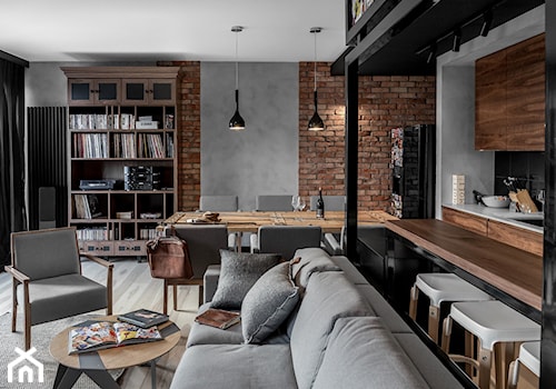 Apartament w Gdańsku - Średni szary salon z kuchnią z jadalnią z bibiloteczką, styl industrialny - zdjęcie od SIKORA WNĘTRZA