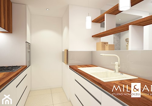 Mieszkanie w Poniatowej - Średnia otwarta biała z zabudowaną lodówką z nablatowym zlewozmywakiem kuchnia dwurzędowa, styl nowoczesny - zdjęcie od Miliart Studio