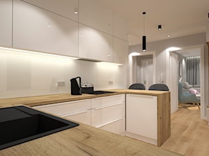 Klimatyczne mieszkanie w bloku z wielkiej płyty - Średnia otwarta biała z zabudowaną lodówką z nablatowym zlewozmywakiem kuchnia w kształcie litery u, styl nowoczesny - zdjęcie od Miliart Studio