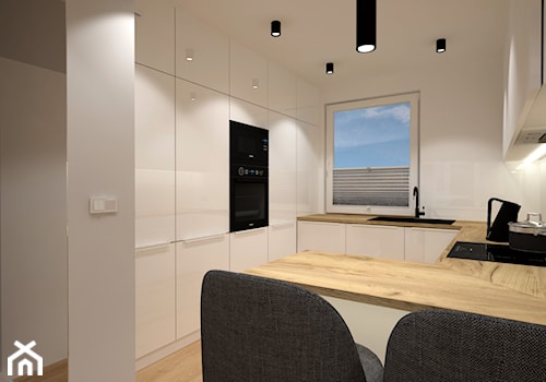 Klimatyczne mieszkanie w bloku z wielkiej płyty - Średnia otwarta biała z zabudowaną lodówką z lodówką wolnostojącą z nablatowym zlewozmywakiem kuchnia w kształcie litery g z oknem, styl nowoczesny - zdjęcie od Miliart Studio