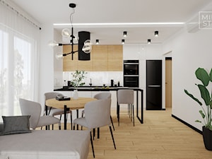 Kuchnia i jadalnia w bieli i drewnie - zdjęcie od Miliart Studio