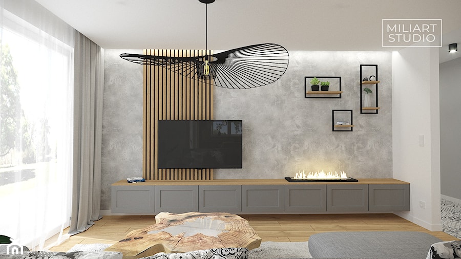 Salon z biokominkiem, betonową ścianą i lamelami - zdjęcie od Miliart Studio