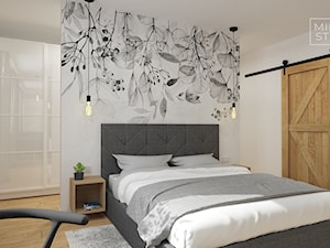 Sypialnia z tapicerowanym łóżkiem i fototapetą - zdjęcie od Miliart Studio