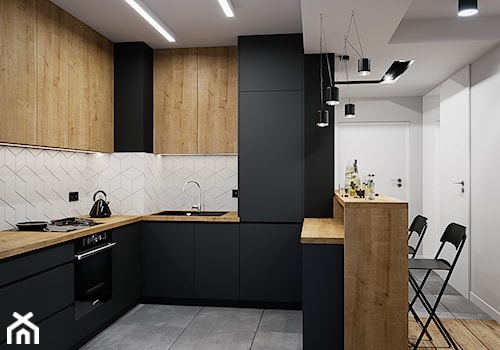 Mieszkanie 53m2 Bemowo - Średnia otwarta czarna szara z zabudowaną lodówką z lodówką wolnostojącą z nablatowym zlewozmywakiem kuchnia w kształcie litery u, styl nowoczesny - zdjęcie od DEDEKO