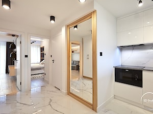 Biała minimalistyczna kuchnia otwarta na mieszkanie - zdjęcie od SD Studio Projektowanie wnętrz