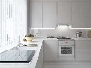 kąt w stylu modern - Średnia otwarta biała z podblatowym zlewozmywakiem kuchnia w kształcie litery l, styl nowoczesny - zdjęcie od troomono