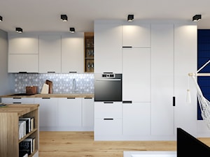 House flipping - inwestowanie w mieszkania - Średnia otwarta czarna szara z zabudowaną lodówką kuchnia w kształcie litery l z wyspą lub półwyspem - zdjęcie od Architekt Wnętrz Patrycja Wojtaś