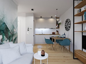 House flipping - inwestowanie w mieszkania - Mały biały szary salon z kuchnią z jadalnią z bibiloteczką - zdjęcie od Architekt Wnętrz Patrycja Wojtaś