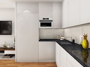 Mieszkanie dla singla - Średnia otwarta z salonem z kamiennym blatem szara z zabudowaną lodówką z podblatowym zlewozmywakiem kuchnia w kształcie litery l, styl minimalistyczny - zdjęcie od Viva Design Rzeszów