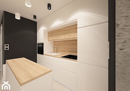 Mieszkanie na wynajem_2 - Średnia otwarta czarna szara z zabudowaną lodówką z nablatowym zlewozmywakiem kuchnia jednorzędowa z wyspą lub półwyspem, styl nowoczesny - zdjęcie od Pracownia Projektowa "Interior-Art"