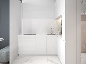 Nowoczesny minimalizm - Mała otwarta z kamiennym blatem biała z zabudowaną lodówką z nablatowym zlewozmywakiem kuchnia w kształcie litery l, styl nowoczesny - zdjęcie od Followlab