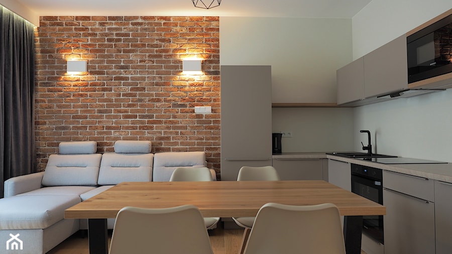 apartamenty pod wynajem - Mały beżowy salon z kuchnią z jadalnią, styl skandynawski - zdjęcie od Vitrum System