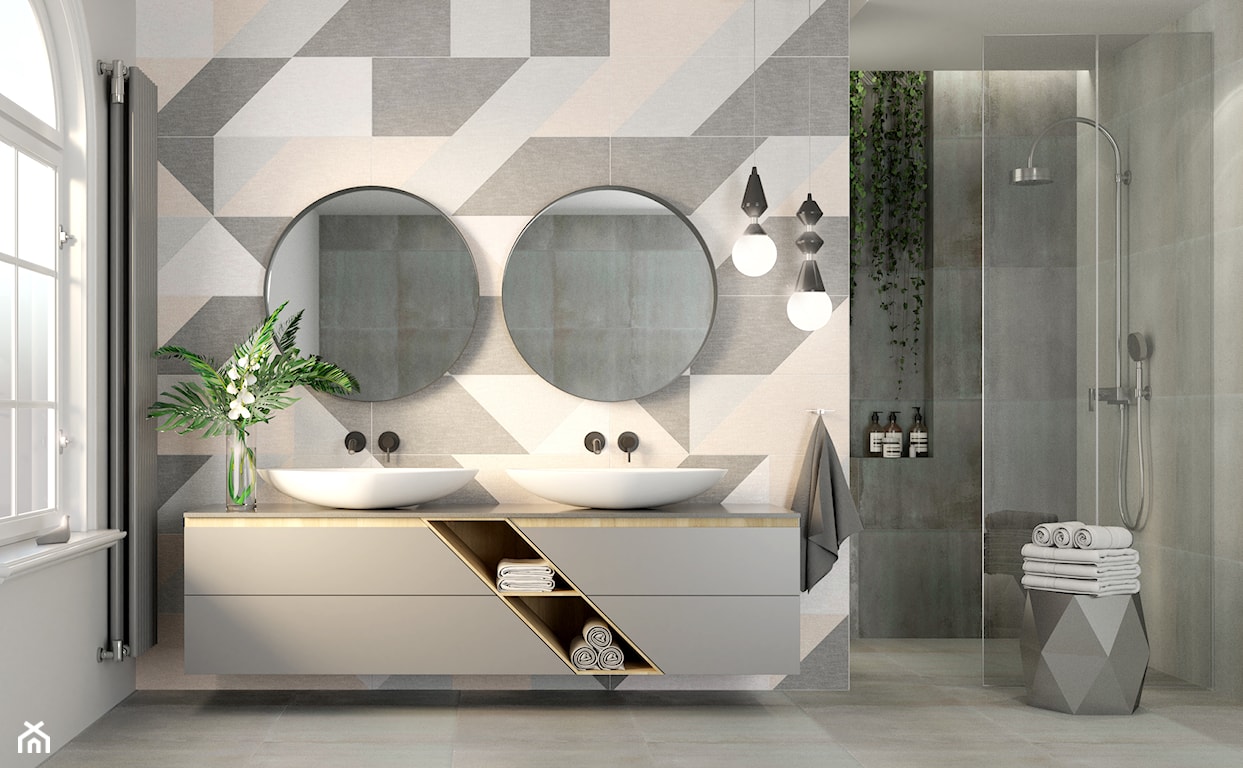 płytki łazienkowe ułożone w geometryczny wzór, okrągłe lustra, dwie umywalki w łazience