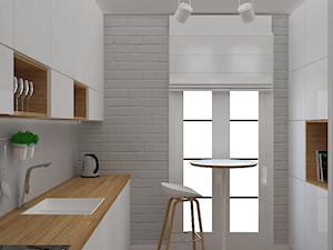 Mieszkanie w ciepłym skandynawskim stylu - Średnia zamknięta szara z zabudowaną lodówką z lodówką wolnostojącą z nablatowym zlewozmywakiem kuchnia dwurzędowa z oknem, styl skandynawski - zdjęcie od Design Factory Studio Projektowe