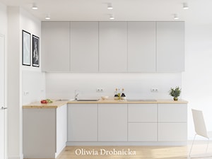 Projekt mieszkania na Śląsku - Średnia otwarta biała z zabudowaną lodówką z nablatowym zlewozmywakiem kuchnia w kształcie litery l, styl nowoczesny - zdjęcie od Projektowanie Wnętrz Oliwia Drobnicka