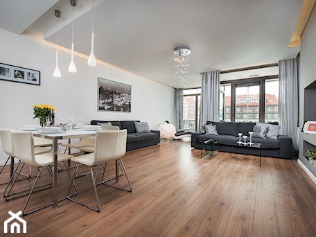 Aranżacje wnętrz - Salon: apartament Waterline 1 Gdańsk - Duży biały salon z jadalnią z tarasem / balkonem, styl nowoczesny - Pszczołowscy projektowanie wnętrz. Przeglądaj, dodawaj i zapisuj najlepsze zdjęcia, pomysły i inspiracje designerskie. W bazie mamy już prawie milion fotografii!