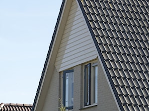 Aranżacje - Średnie jednopiętrowe domy jednorodzinne murowane z dwuspadowym dachem - zdjęcie od Ralston