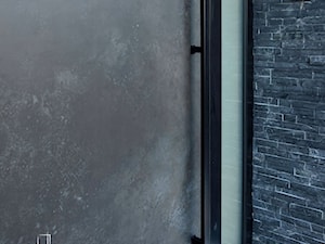 Nowoczesne drzwi wejściowe ze spiekiem Ossido Nero - zdjęcie od RK Pivot Doors - zewnętrzne drzwi pivot