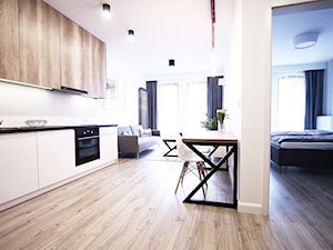 mieszkanie na wynajem - Otwarta z salonem biała z zabudowaną lodówką kuchnia jednorzędowa, styl nowoczesny - zdjęcie od Bogaczewicz Architecture Studio