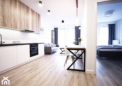 mieszkanie na wynajem - Otwarta z salonem biała z zabudowaną lodówką kuchnia jednorzędowa, styl nowoczesny - zdjęcie od Bogaczewicz Architecture Studio