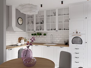 Kolorowy artyzm - Średnia otwarta z salonem biała szara z zabudowaną lodówką z podblatowym zlewozmywakiem kuchnia w kształcie litery l, styl skandynawski - zdjęcie od EG projekt