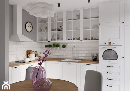 Kolorowy artyzm - Średnia otwarta z salonem biała szara z zabudowaną lodówką z podblatowym zlewozmywakiem kuchnia w kształcie litery l, styl skandynawski - zdjęcie od EG projekt