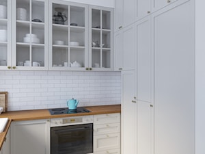 Zielone Bielany - Mała otwarta biała z zabudowaną lodówką z nablatowym zlewozmywakiem kuchnia w kształcie litery u, styl skandynawski - zdjęcie od EG projekt