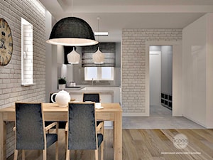 Segment w warszawie - Średnia biała jadalnia jako osobne pomieszczenie - zdjęcie od Icona Studio