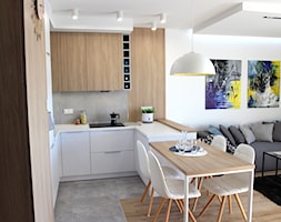 Nowoczesne mieszkanie w apartamentowcu, biel i szarość ocieplane drewnem - Średnia otwarta z salonem ... - zdjęcie od MK HOME - Homebook